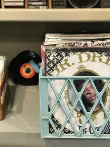 Vintage vinyl records in a blue crate at Travel Eureka Springs store, Arkansas.