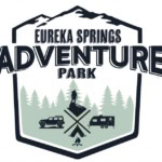 Eureka Springs Adventure Park logo with mountains, trees, and outdoor activities.