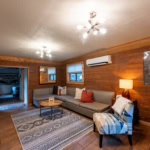 Cozy living room in a Eureka Springs cabin with wood accents and modern decor.